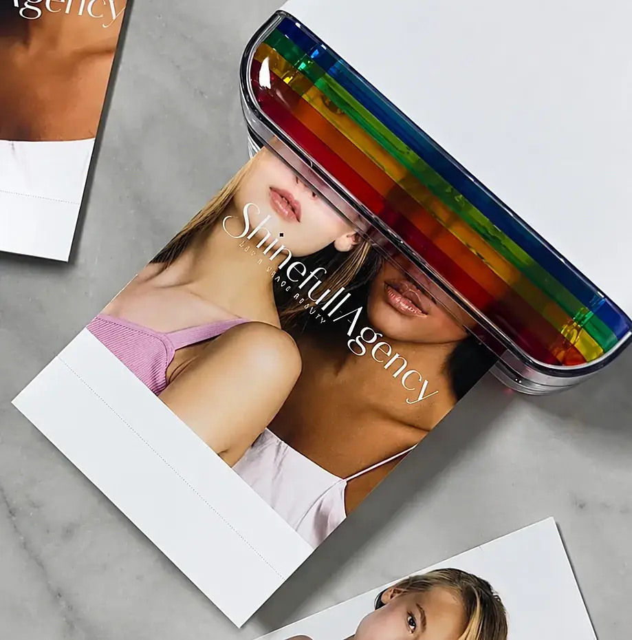 Shinefull Agency printed model portraits on a marble table